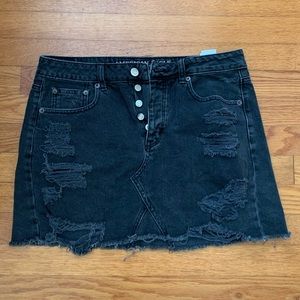 American Eagle distressed black jean mini skirt.